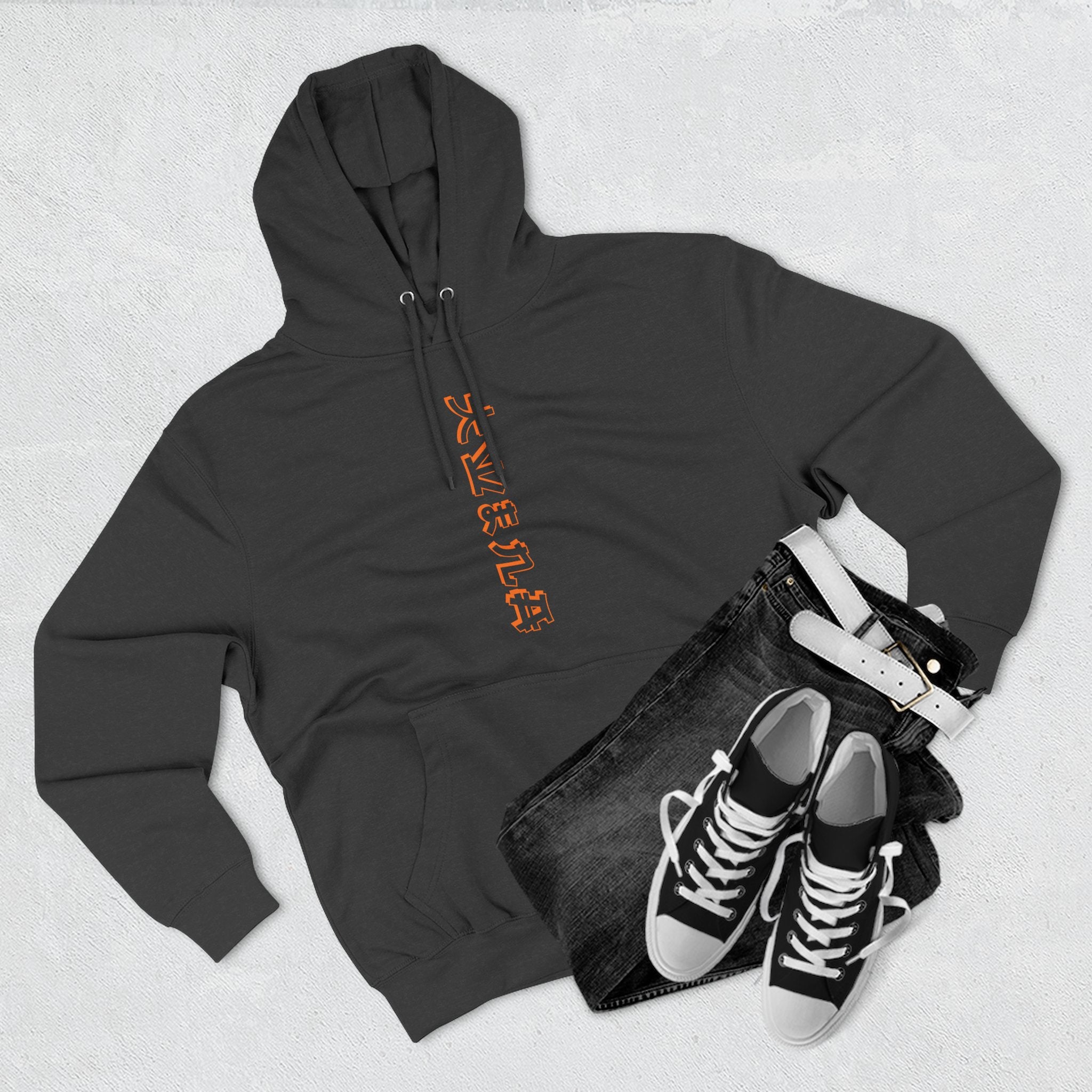 Minimalist black sweatshirt featuring bold orange and white print.